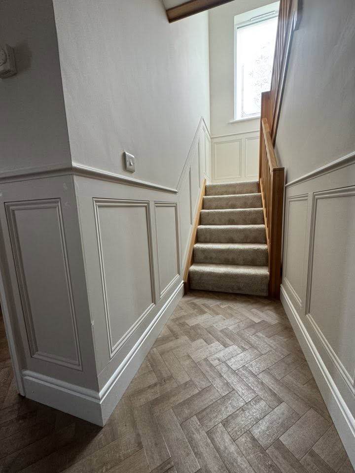Hallway wainscot panelling with herringbone floor