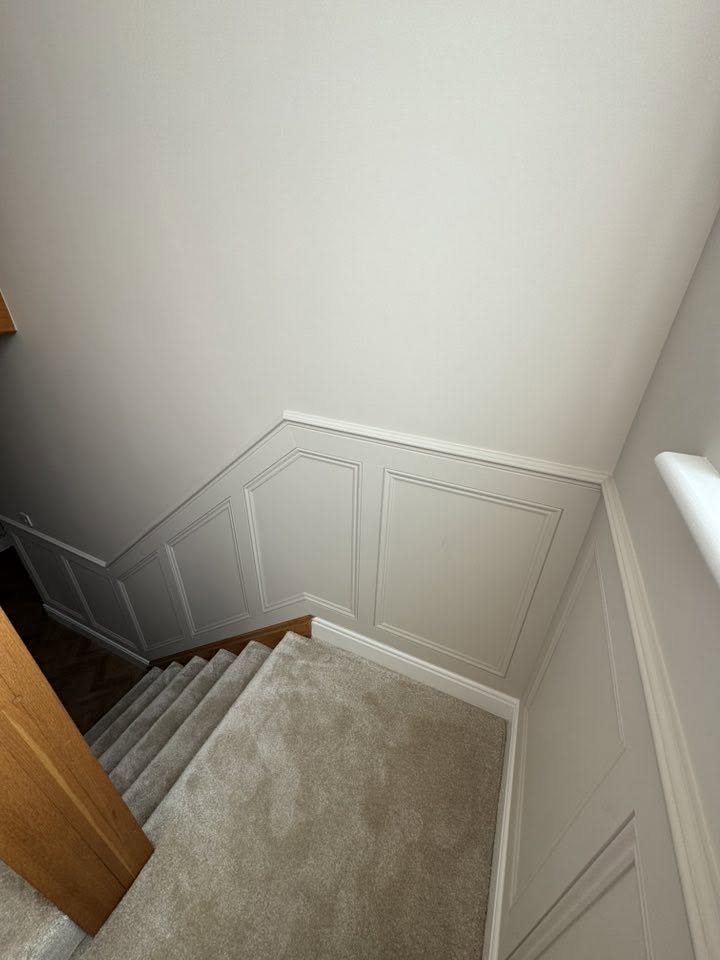Stairwell panelling — clean lines top to bottom