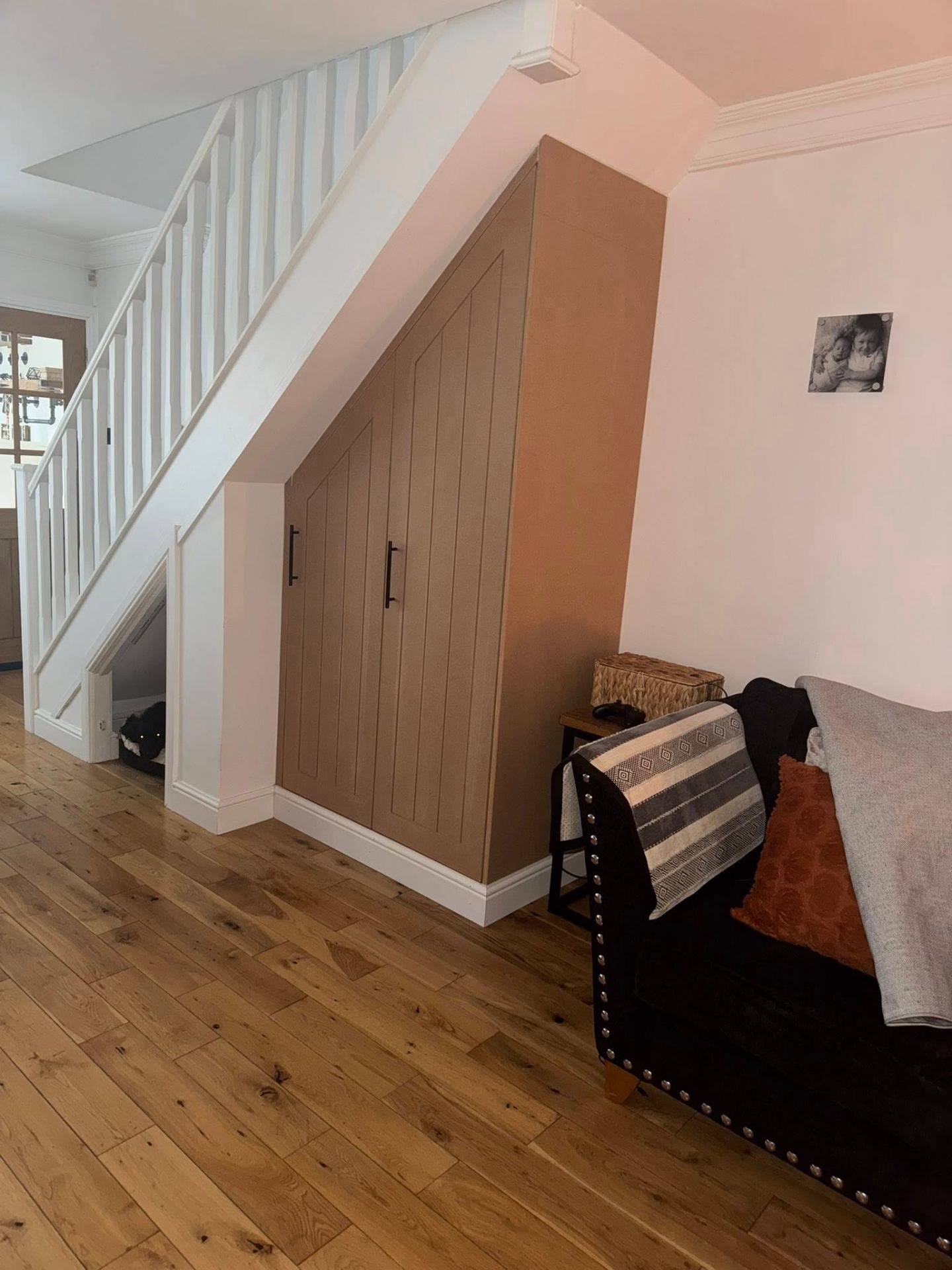 After — bespoke under-stairs cupboards with shaker doors